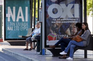 Referendum campaign posters that reads "No" and "Yes" in Greek are seen on a bus stop in Athens